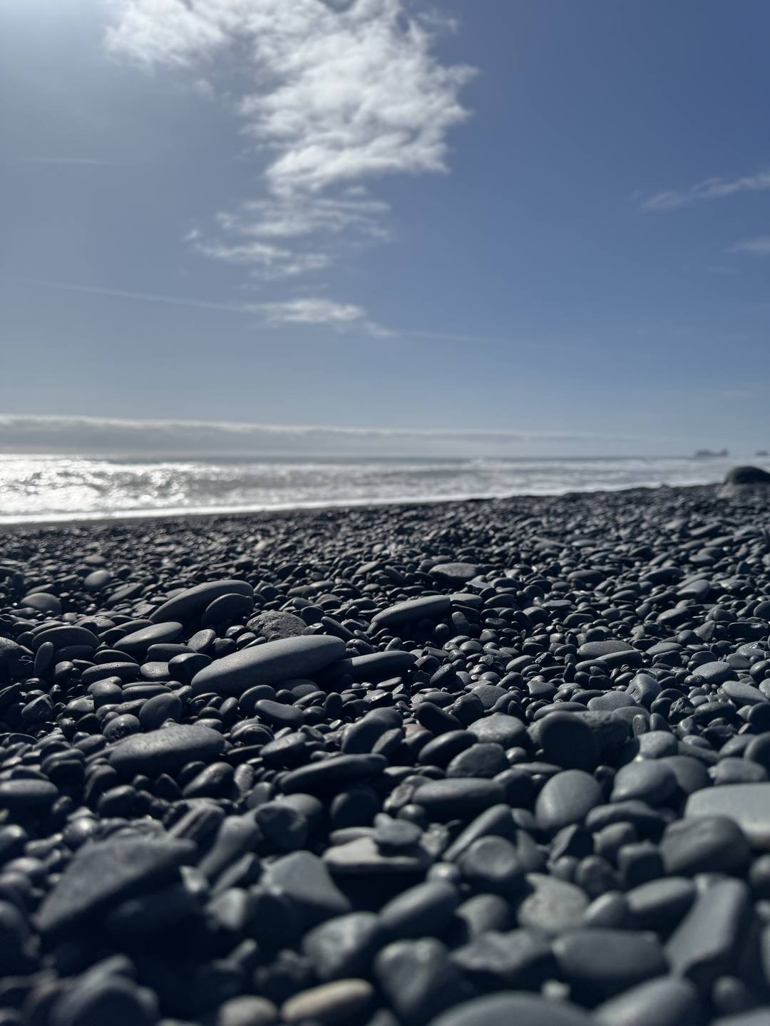 Rounded black basalt pebbles close up at Reynisfjara beach